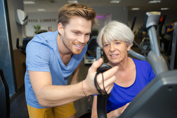 older woman with trainer